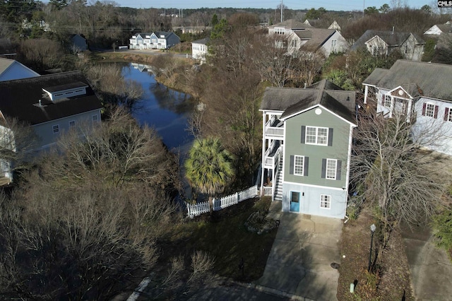 birds eye view of property with a residential view and a water view