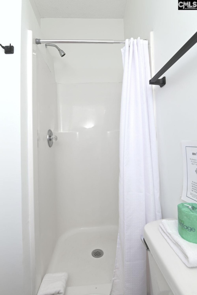 bathroom with a stall shower