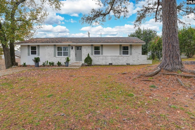 single story home featuring brick siding and crawl space