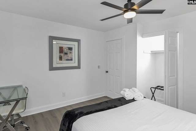 bedroom with baseboards, a ceiling fan, and dark wood-style flooring