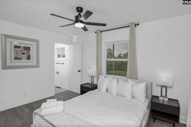 bedroom featuring ceiling fan, baseboards, and dark wood-style floors