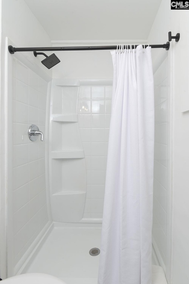 full bathroom with a shower stall