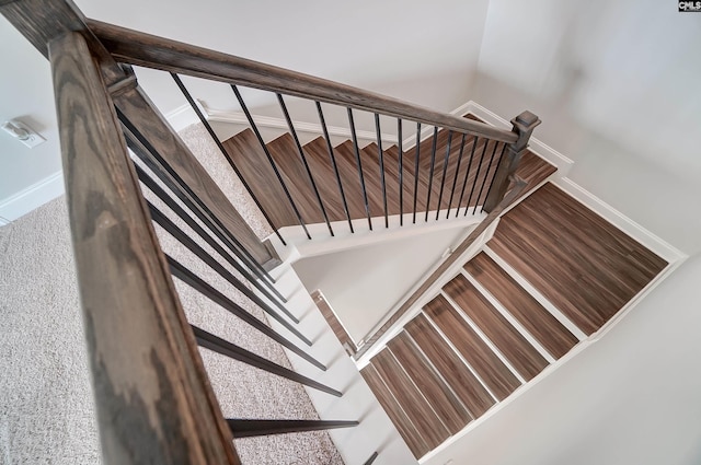 stairway featuring baseboards