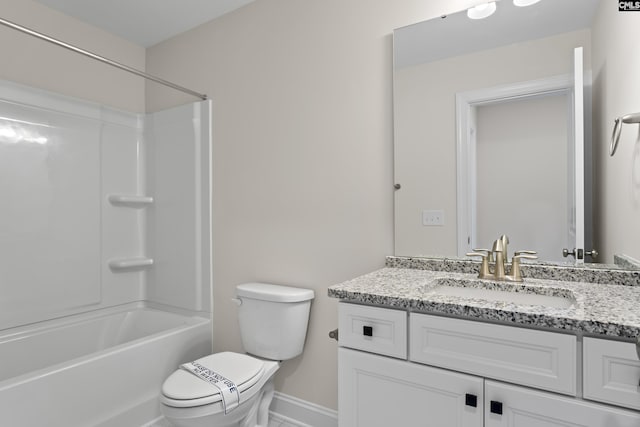 full bathroom with shower / bath combination, toilet, vanity, and baseboards