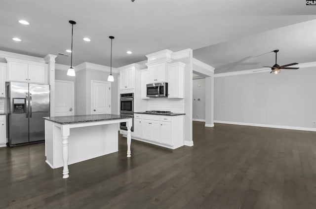 kitchen with a kitchen breakfast bar, backsplash, dark wood-style floors, stainless steel appliances, and white cabinets