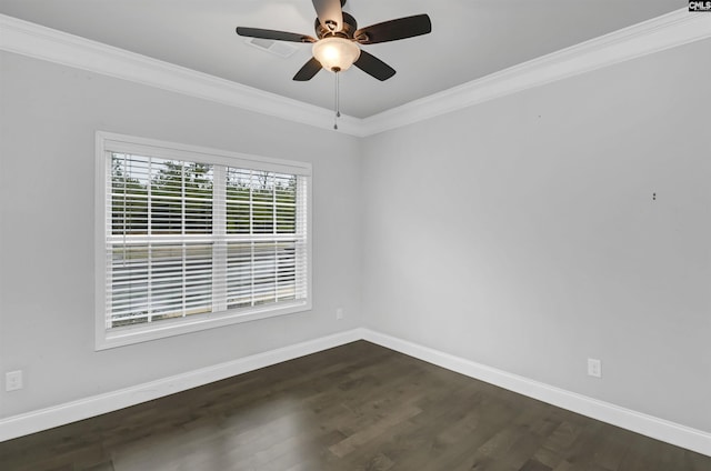 unfurnished room featuring baseboards, dark wood-style floors, and crown molding