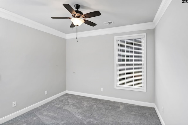 unfurnished room featuring carpet flooring, visible vents, baseboards, and ornamental molding