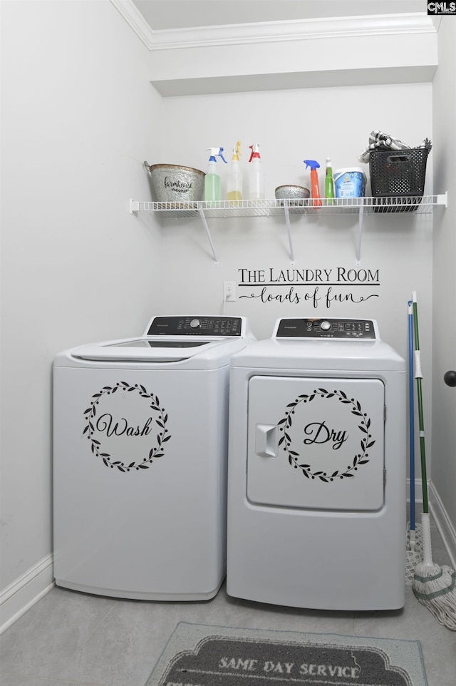 laundry room with laundry area, crown molding, independent washer and dryer, and baseboards