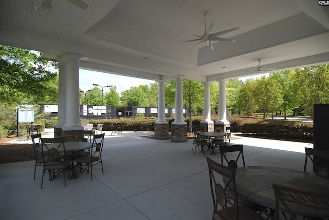 view of patio / terrace with outdoor dining area, ceiling fan, and fence