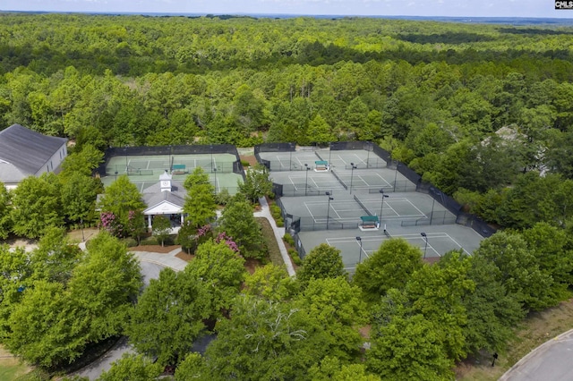 birds eye view of property with a forest view