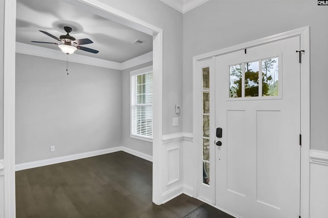 entrance foyer featuring a ceiling fan, crown molding, baseboards, and dark wood-style flooring