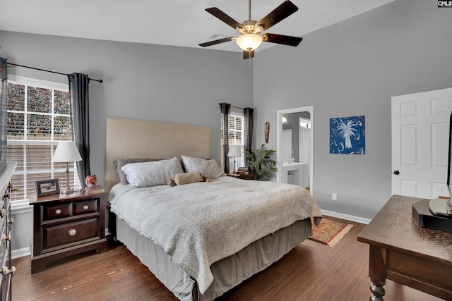 bedroom with dark wood finished floors, a ceiling fan, and baseboards