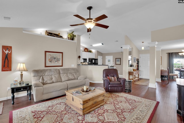 living room featuring visible vents, lofted ceiling, decorative columns, ceiling fan, and dark wood-type flooring