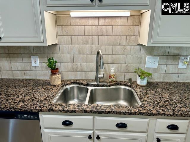 details with a sink, decorative backsplash, dishwasher, and white cabinetry