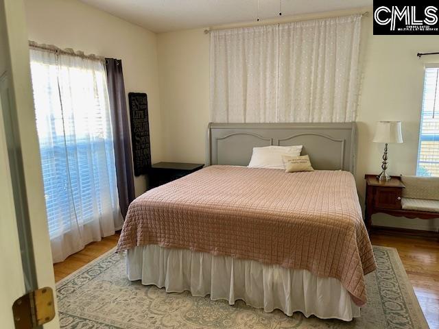 bedroom featuring wood finished floors