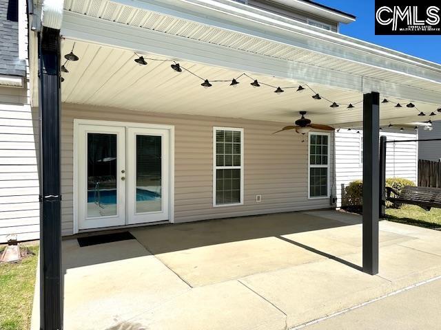 view of patio / terrace with french doors and a ceiling fan