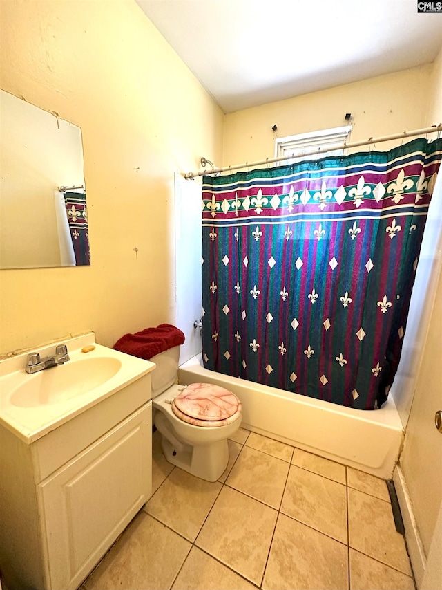 full bath with tile patterned flooring, shower / bath combination with curtain, toilet, and vanity