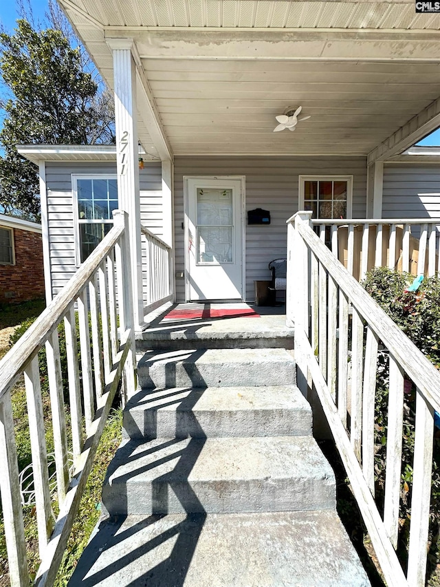 view of exterior entry with a porch