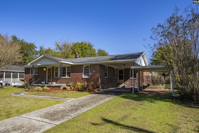 ranch-style house featuring brick siding, an attached carport, and a front lawn