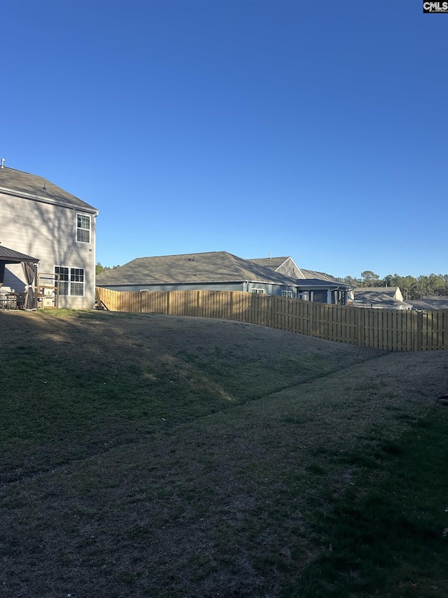 view of yard featuring a gazebo and a fenced backyard