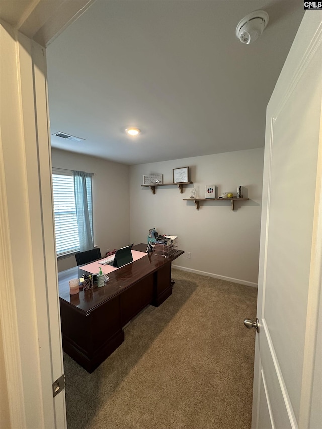 home office featuring visible vents, baseboards, and carpet