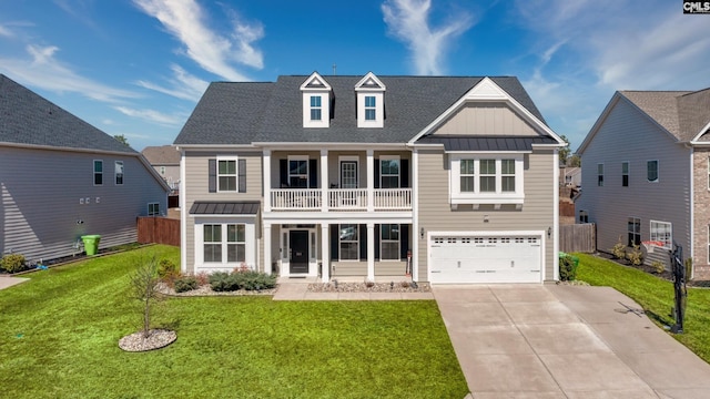 view of front facade with driveway, a front lawn, a standing seam roof, board and batten siding, and a balcony