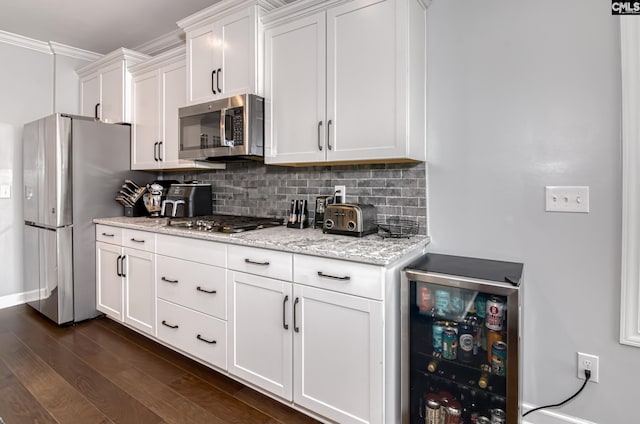 263 Compass Trl, Blythewood, SC 29016 - kitchen featuring beverage cooler, dark wood-type flooring, white cabinets, appliances with stainless steel finishes, and tasteful backsplash