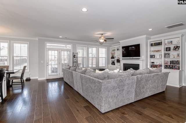 263 Compass Trl, Blythewood, SC 29016 - living room featuring visible vents, a fireplace, dark wood-style flooring, and crown molding