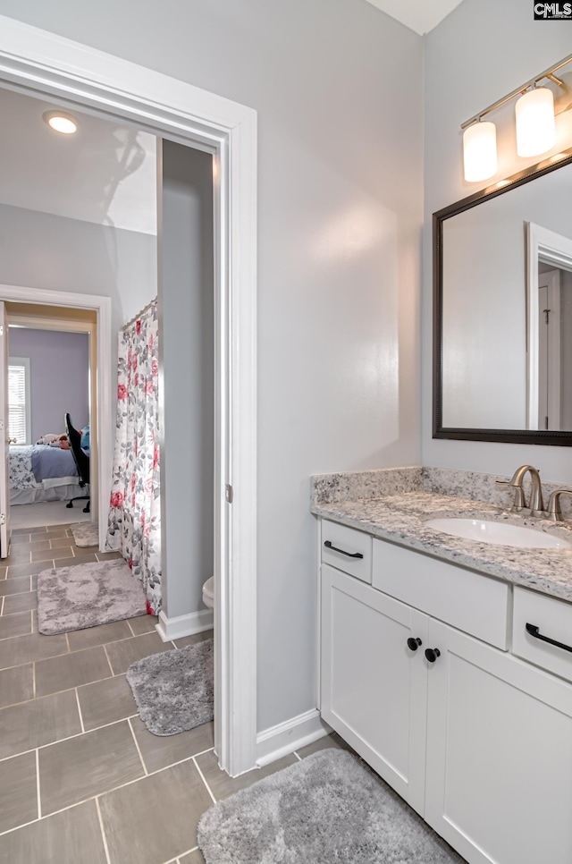 263 Compass Trl, Blythewood, SC 29016 - bathroom with vanity, a shower with curtain, baseboards, and ensuite bathroom