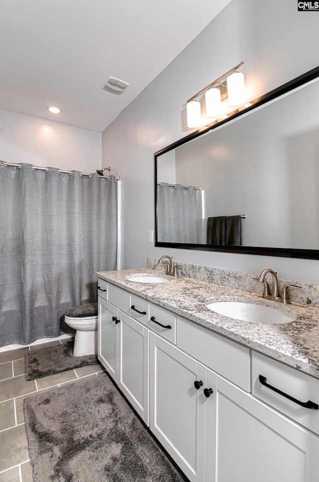 263 Compass Trl, Blythewood, SC 29016 - full bath with a sink, visible vents, toilet, and double vanity