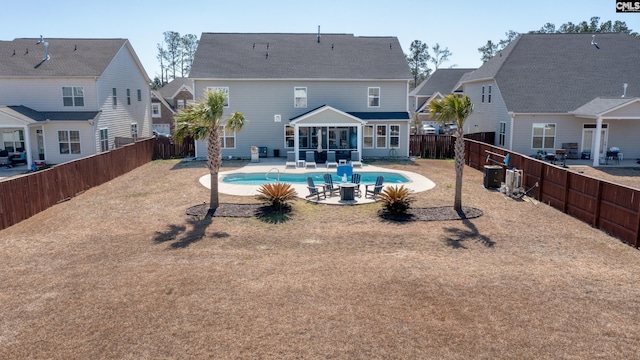 263 Compass Trl, Blythewood, SC 29016 - rear view of property with a fenced backyard, cooling unit, a sunroom, a fenced in pool, and a patio area