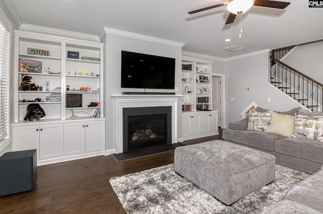 263 Compass Trl, Blythewood, SC 29016 - living area featuring stairway, dark wood-style floors, visible vents, ornamental molding, and a glass covered fireplace