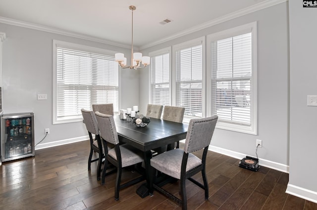 263 Compass Trl, Blythewood, SC 29016 - dining space featuring beverage cooler, dark wood-style floors, baseboards, and ornamental molding