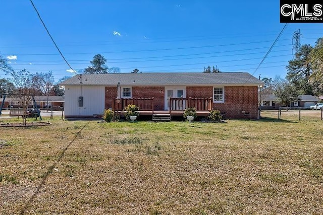 back of house with fence, a wooden deck, a yard, crawl space, and brick siding