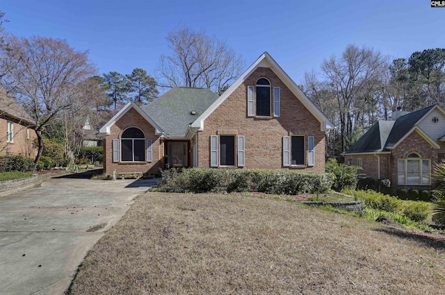 traditional-style house featuring brick siding