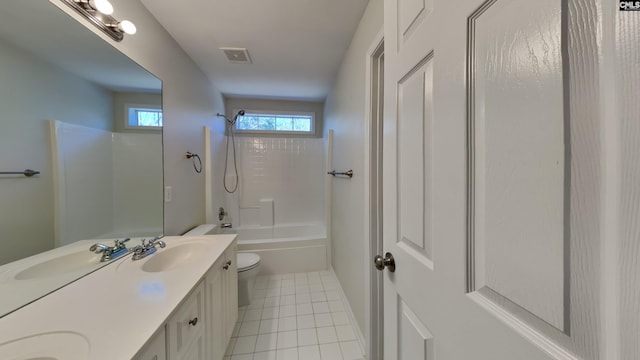 bathroom featuring a sink, toilet, double vanity, and tile patterned flooring