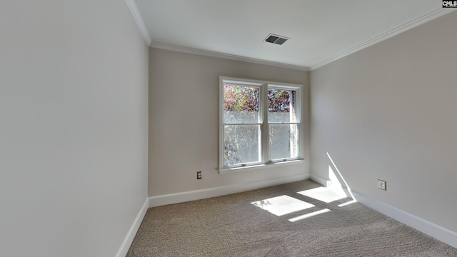 empty room with visible vents, baseboards, carpet floors, and ornamental molding