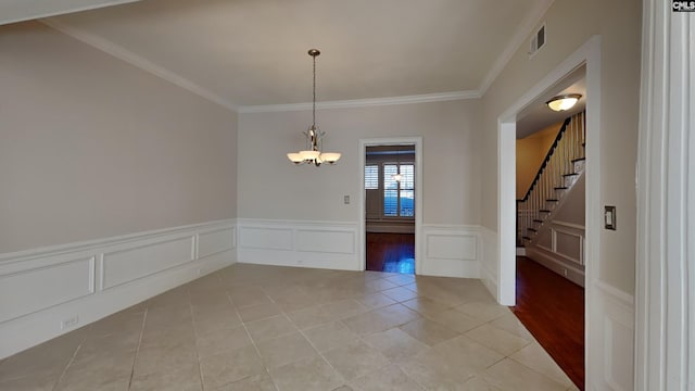 empty room featuring visible vents, an inviting chandelier, light tile patterned flooring, ornamental molding, and stairs