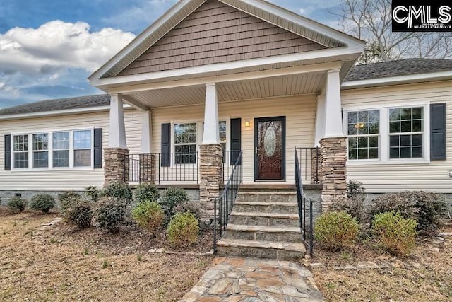 doorway to property with covered porch and crawl space