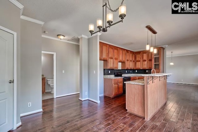 kitchen with dark wood-type flooring, black range with electric cooktop, crown molding, and light countertops