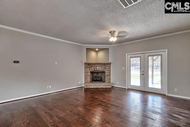 unfurnished living room with french doors, baseboards, ornamental molding, and hardwood / wood-style flooring