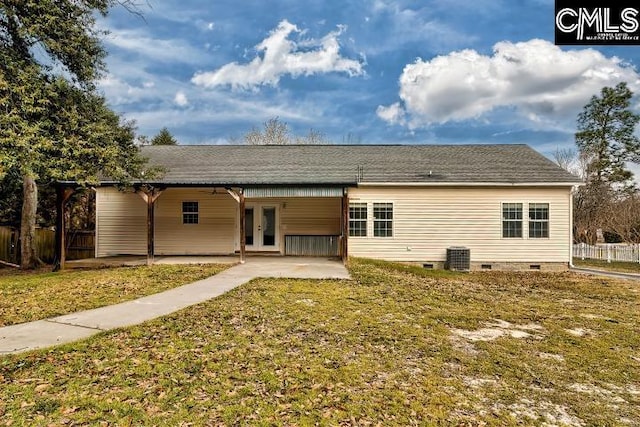 rear view of property featuring a patio, fence, a yard, french doors, and crawl space