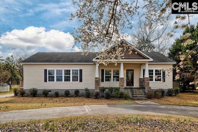 craftsman-style house featuring crawl space and covered porch