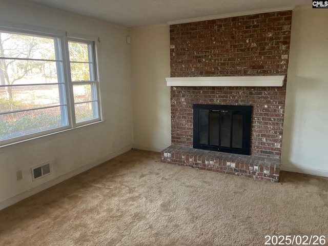 unfurnished living room with visible vents, a fireplace, baseboards, and carpet floors