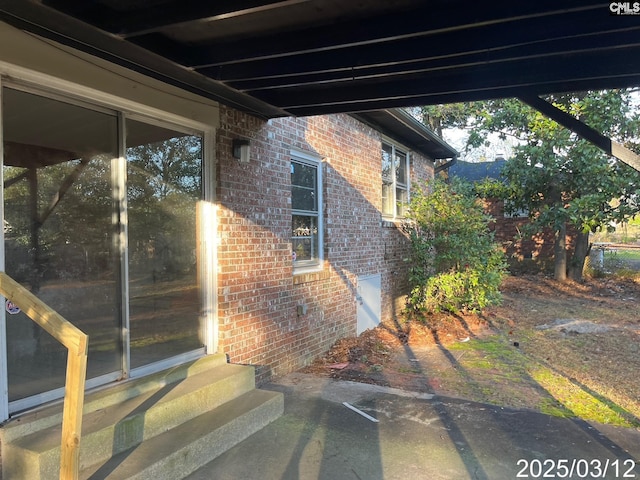 exterior space featuring brick siding