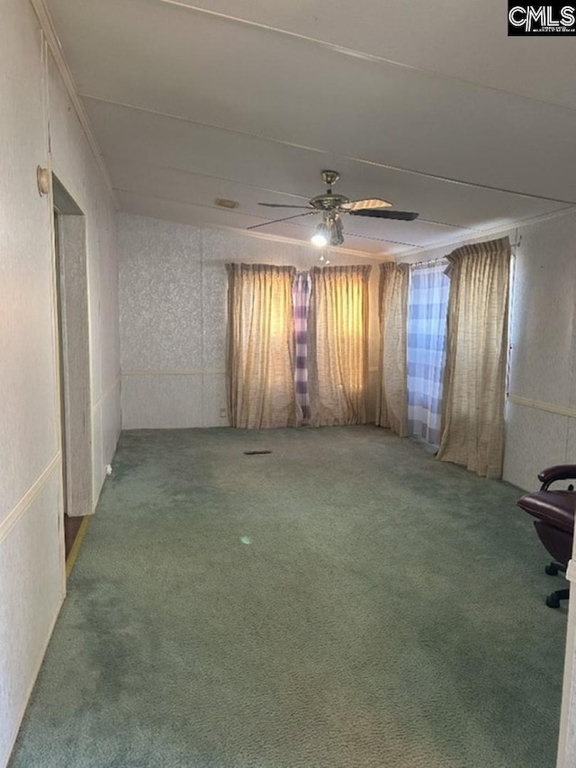 empty room with carpet floors and ceiling fan