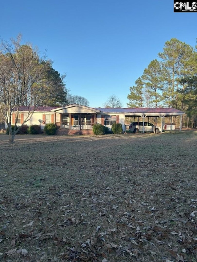 single story home featuring a carport