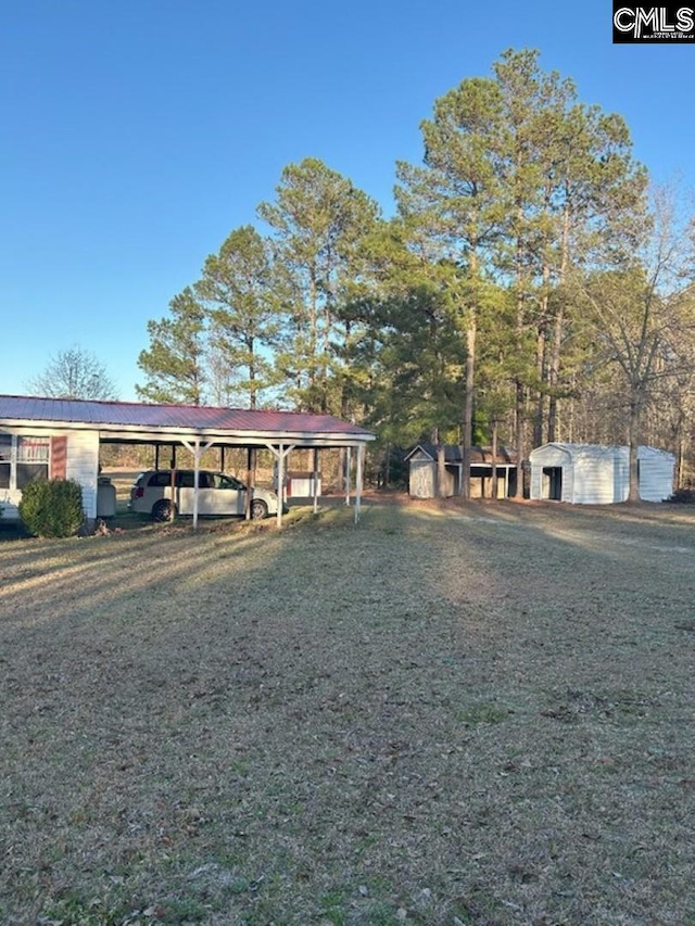 view of front of house featuring an outbuilding, a shed, and metal roof