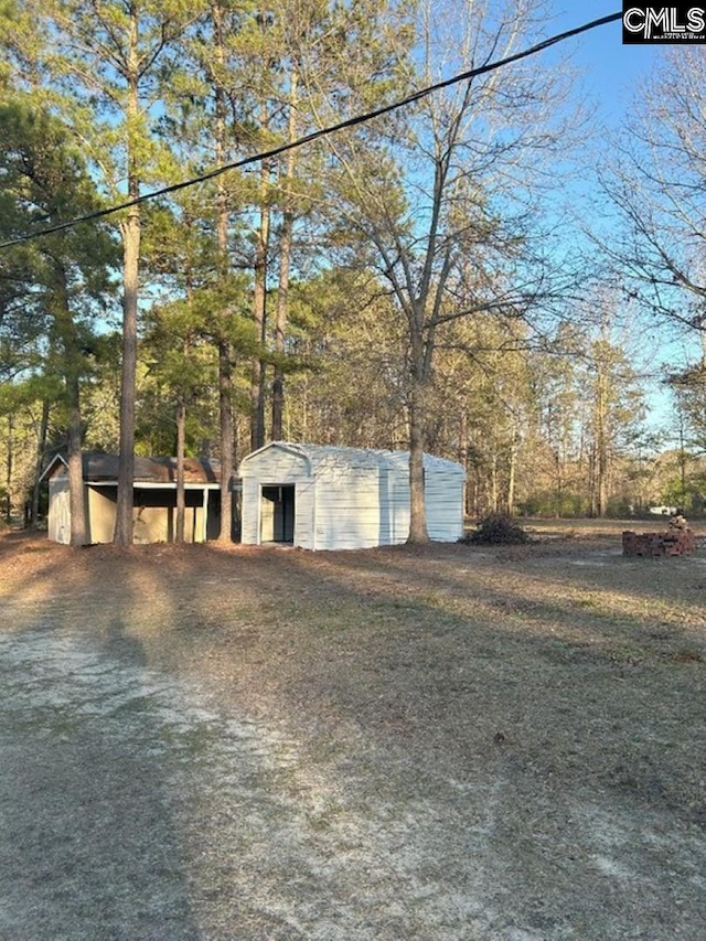 exterior space featuring an outbuilding