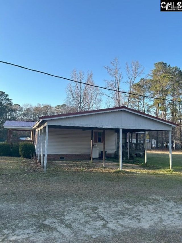 exterior space featuring a carport and crawl space